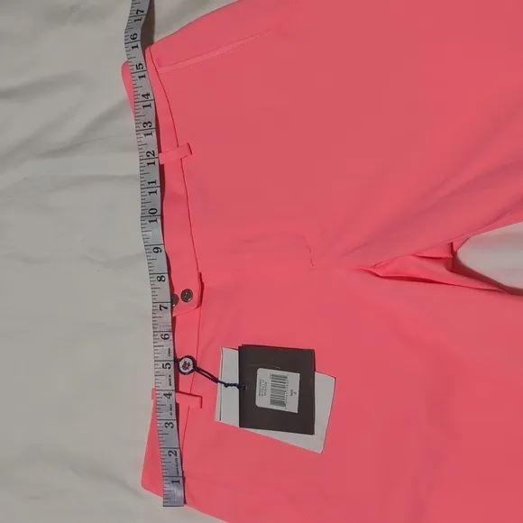 RLX Ralph Lauren women's Neon Rose golf shorts.