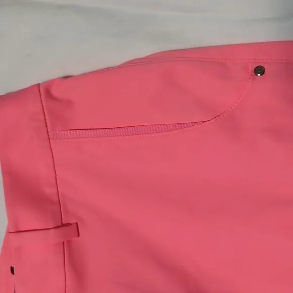 RLX Ralph Lauren women's Neon Rose golf shorts.