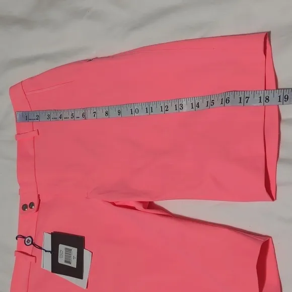 RLX Ralph Lauren women's Neon Rose golf shorts.