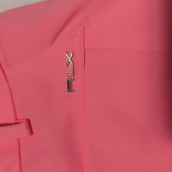 RLX Ralph Lauren women's Neon Rose golf shorts.
