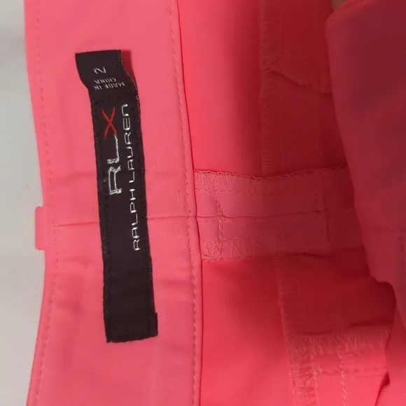 RLX Ralph Lauren women's Neon Rose golf shorts.