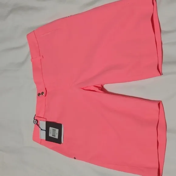 RLX Ralph Lauren women's Neon Rose golf shorts.